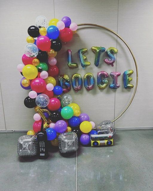 Let's Boogie balloon backdrop on a gold hoop